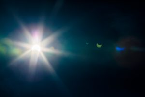 Solar Eclipse of August 21st, 2017 with lens flare and moon reflection.