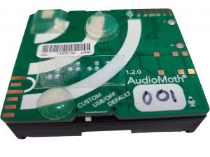 Square circuit board attached to 3 batteries about 3 inches by 3 inches in size.